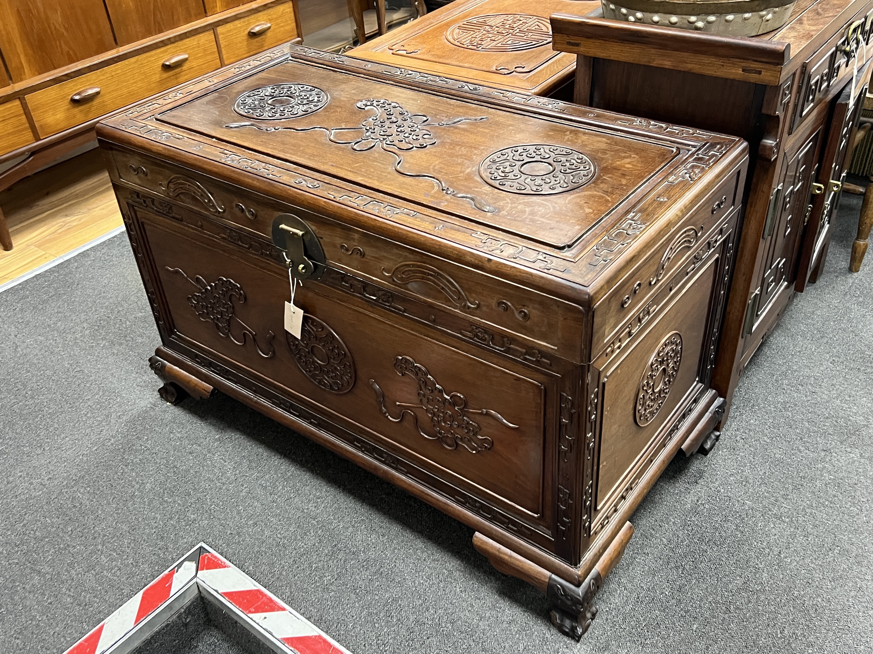 An Asian carved camphorwood trunk, width 100cm, depth 49cm, height 64cm